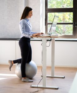Standing desk user with clean cord management