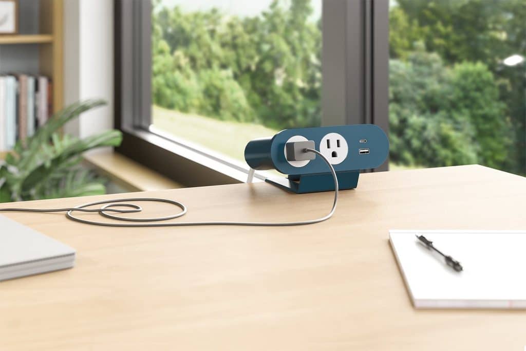 The image shows a power solution mounted on top of a desk.
