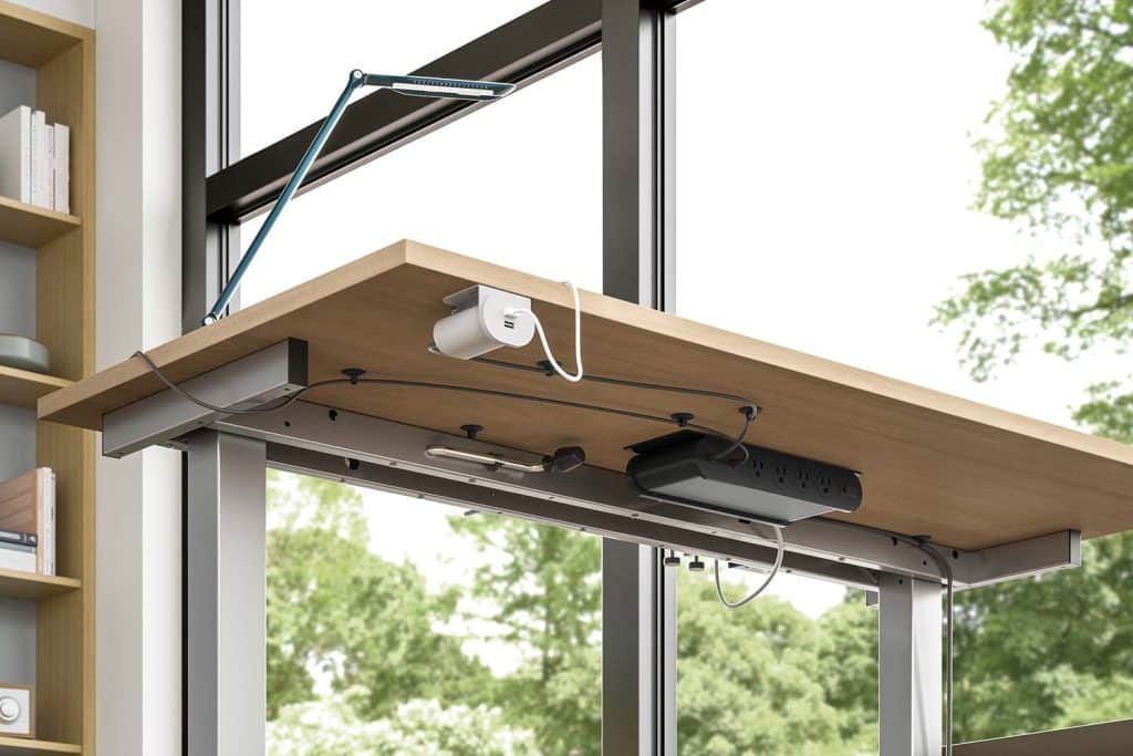 The image shows a good example of good cable management solutions through the use of an under mount power hub.