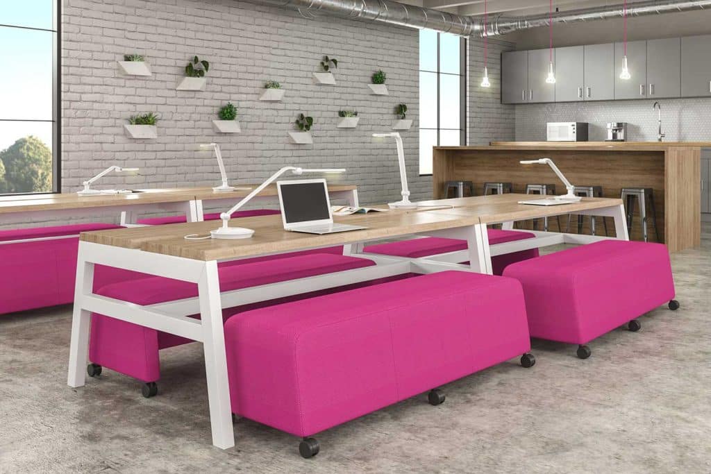 The image shows multiple desk lights being used to illuminate a collaborative workspace.